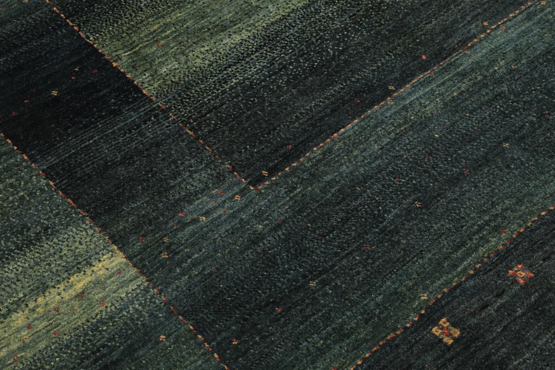 Hand-knotted Loribaft Fine rug from the Middle East in dark-green.