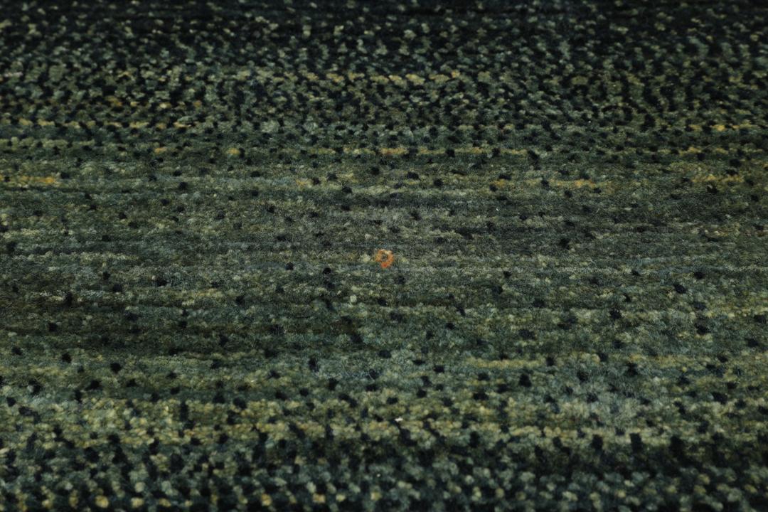 Hand-knotted Loribaft Fine rug from the Middle East in dark-green.
