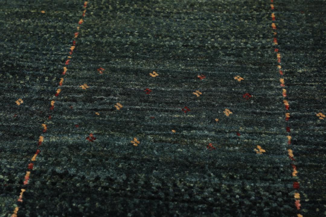 Hand-knotted Loribaft Fine rug from the Middle East in dark-green.