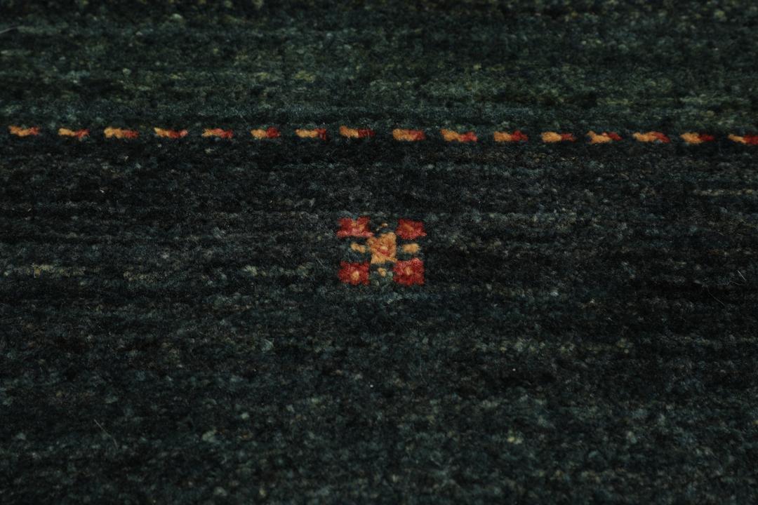 Hand-knotted Loribaft Fine rug from the Middle East in dark-green.