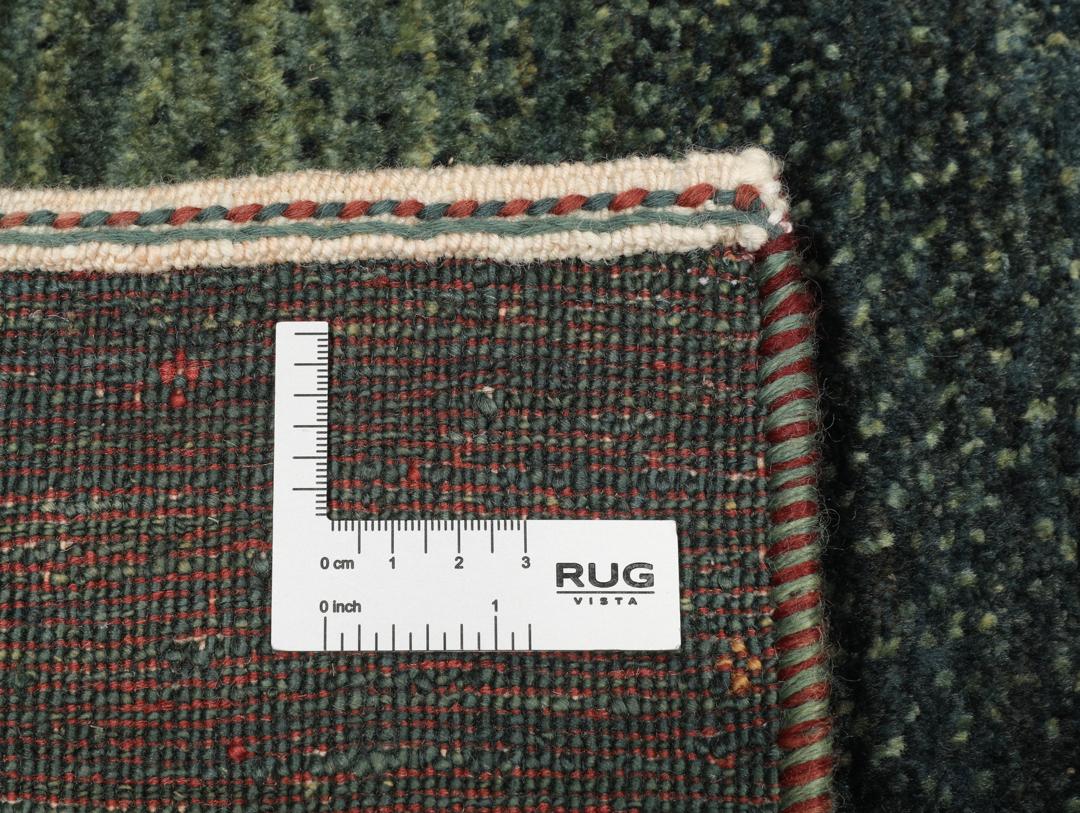 Hand-knotted Loribaft Fine rug from the Middle East in dark-green.