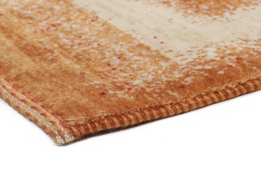 Hand-knotted Loribaft rug with a rich red and beige colour palette.