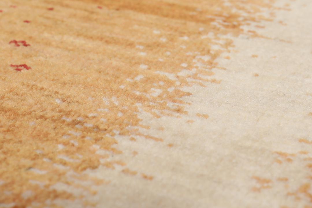 Hand-knotted Loribaft rug with a rich red and beige colour palette.