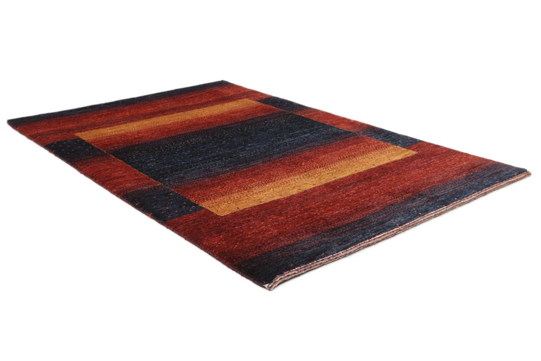 Hand-knotted Loribaft rug from the Middle East in deep red and dark-blue tones.