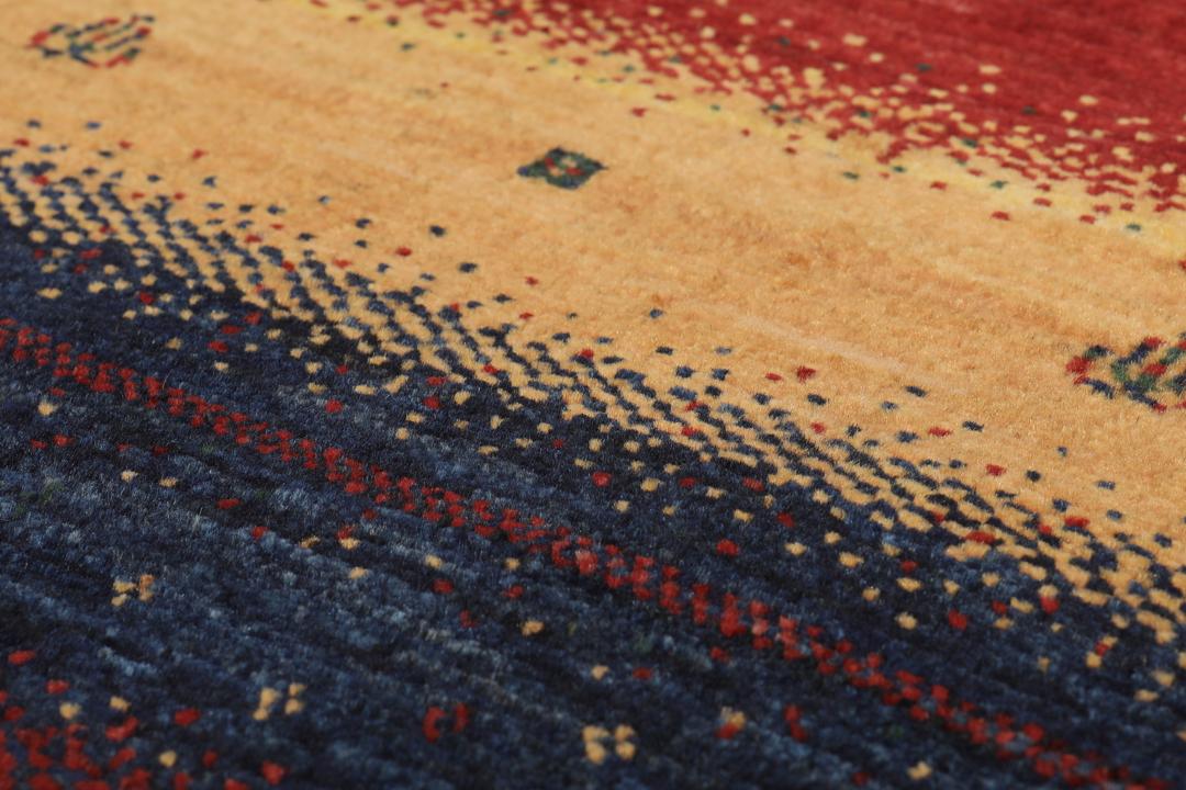 A hand-knotted Middle Eastern Loribaft rug featuring a striped pattern in red, blue, and beige wool.