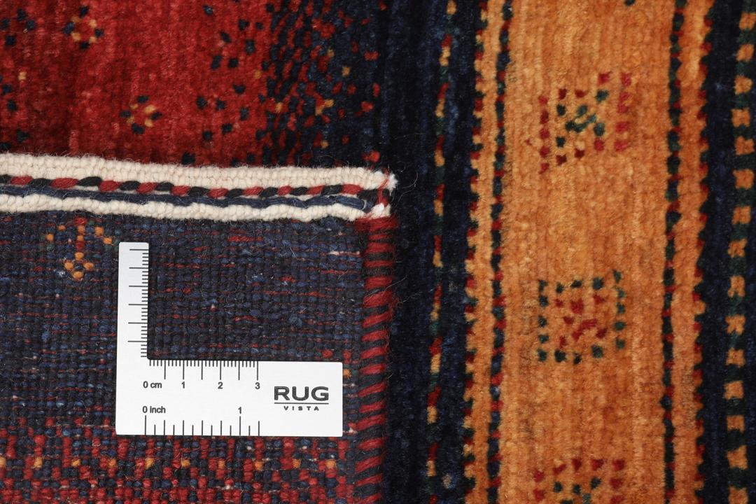 A hand-knotted Middle Eastern Loribaft rug featuring a striped pattern in red, blue, and beige wool.