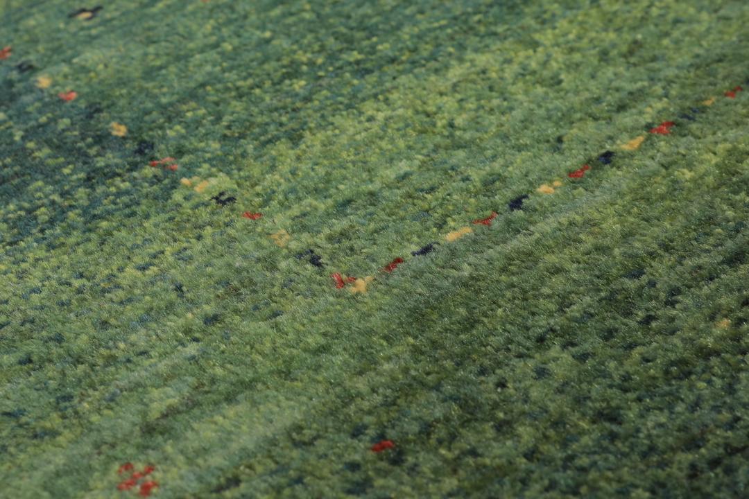 Håndknyttet Loribaft-tæppe fra Mellemøsten i dybe grønne toner