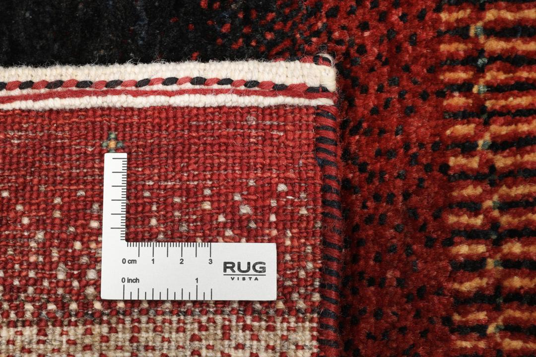 A hand-knotted Loribaft Fine rug from the Middle East featuring red, black, and beige stripes.