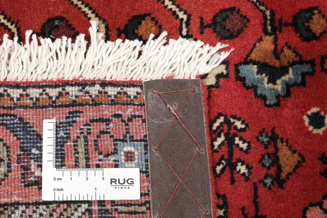 Handgeknoopt Abadeh wollen tapijt uit het Midden-Oosten in dieprode en donkerblauwe tinten.