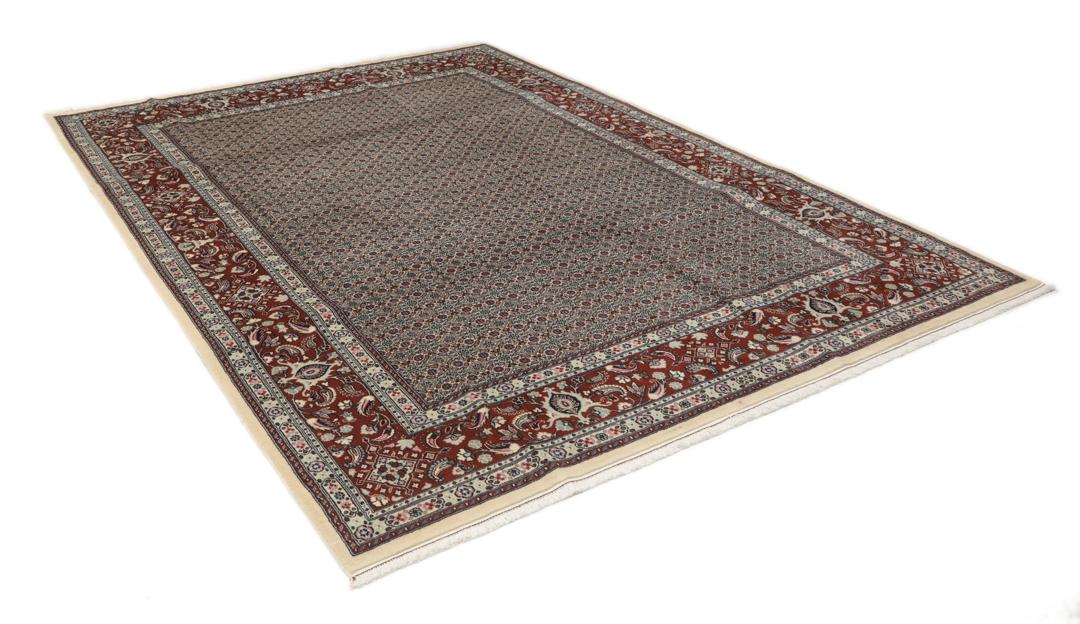 A hand-knotted Moud Wool rug from the Middle East in dark-red and beige tones.