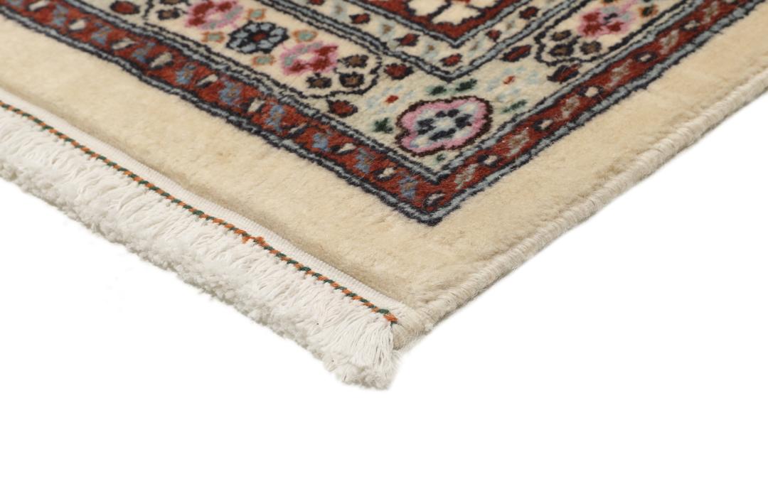 A hand-knotted Moud Wool rug from the Middle East in dark-red and beige tones.