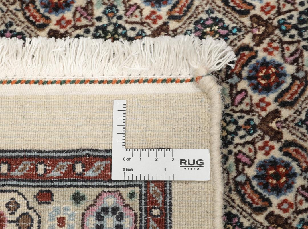 A hand-knotted Moud Wool rug from the Middle East in dark-red and beige tones.
