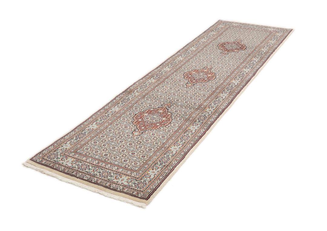 A hand-knotted Moud runner rug with a floral design in multicolor tones
