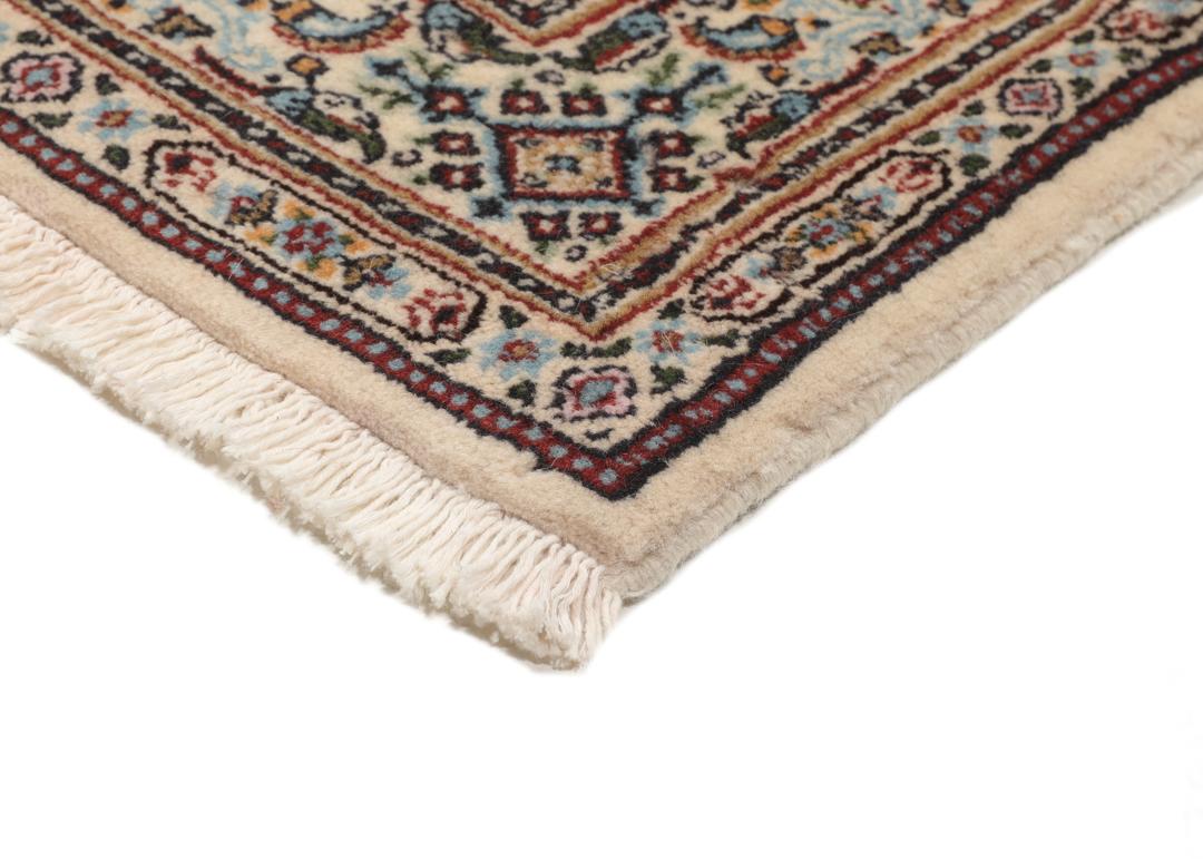 A hand-knotted Moud runner rug with a floral design in multicolor tones