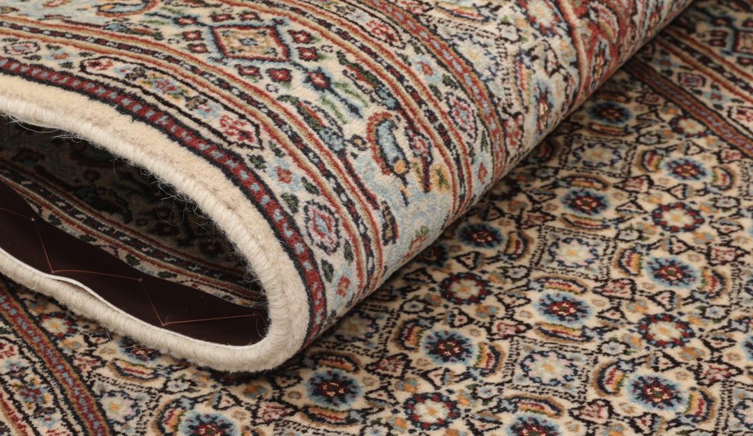 A hand-knotted Moud runner rug with a floral design in multicolor tones