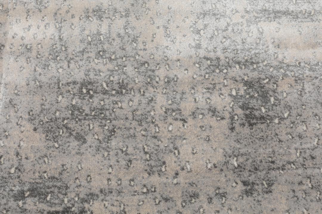 Lichtgrijs tapijt met een zacht gevlekt patroon