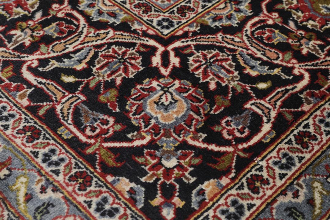Hand-knotted Keshan rug from the Middle East in deep red and black