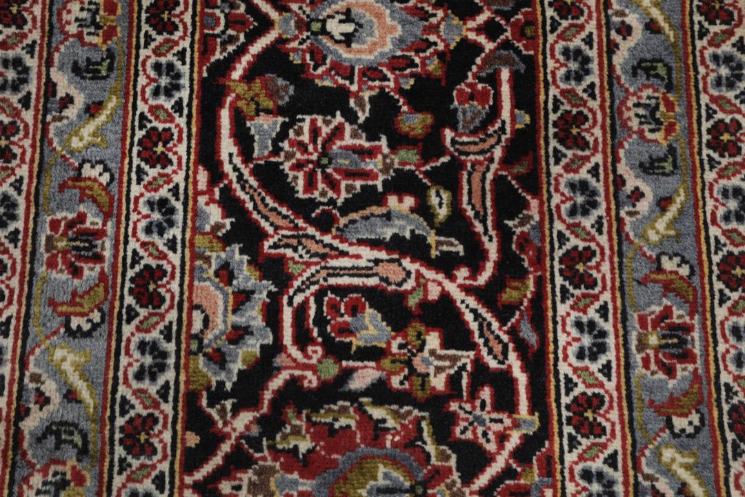 Hand-knotted Keshan rug from the Middle East in deep red and black