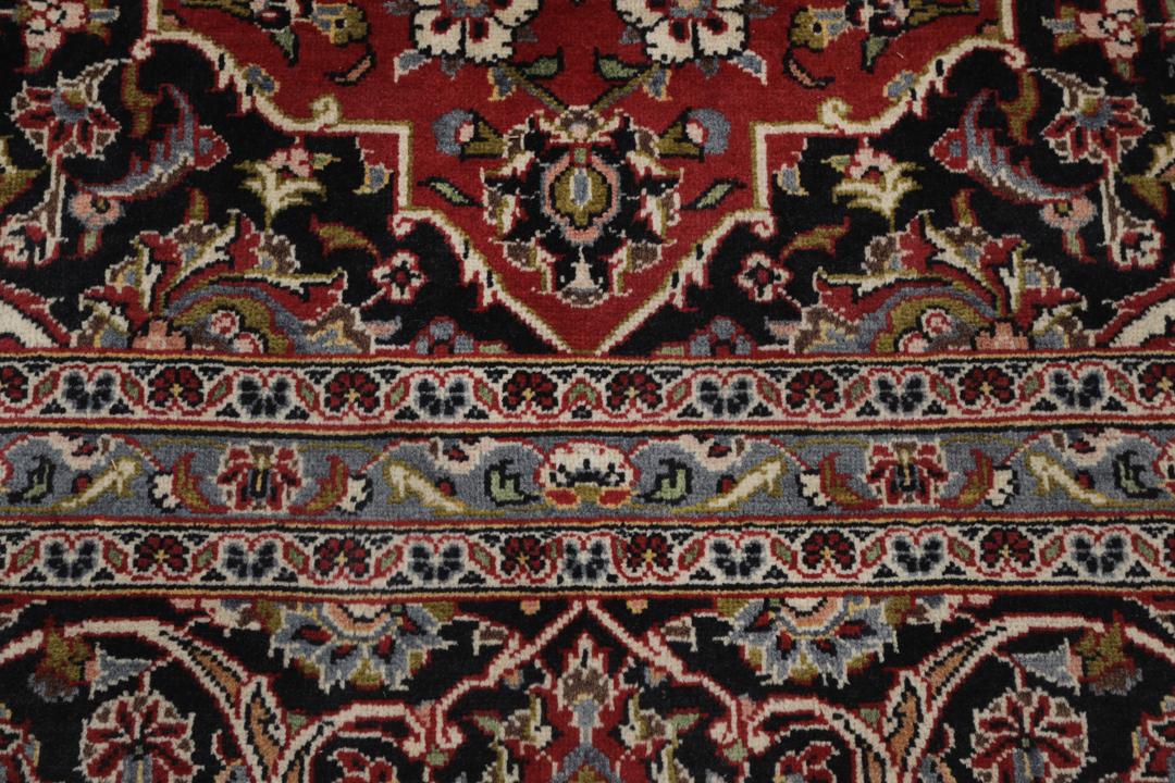Hand-knotted Keshan rug from the Middle East in deep red and black