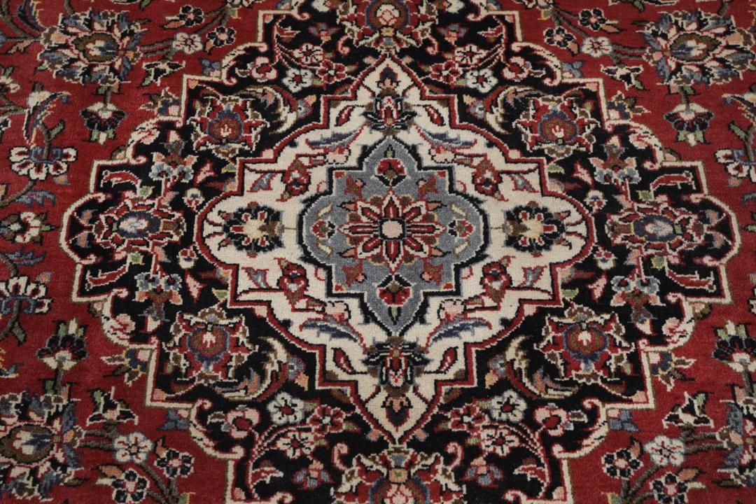 Hand-knotted Keshan rug from the Middle East in deep red and black