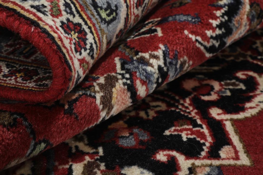 Hand-knotted Keshan rug from the Middle East in deep red and black