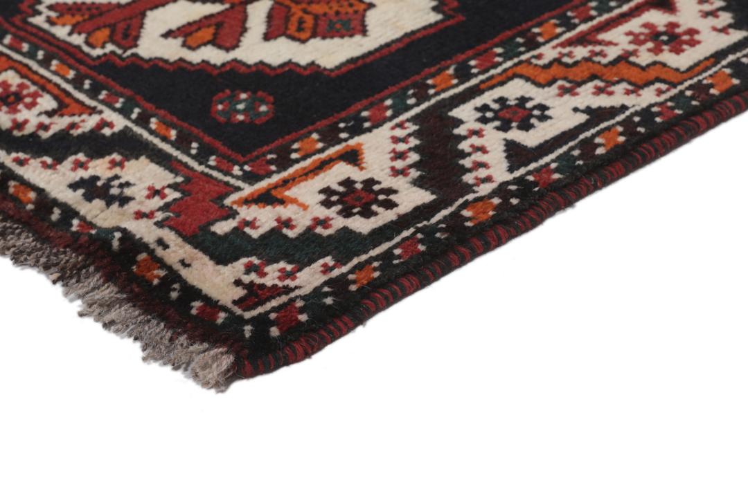 Hand-knotted Shiraz rug from the Middle East in dark-red and black tones.