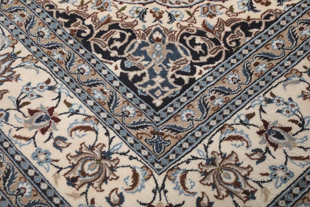 Authentic hand-knotted Nain rug from the Middle East in beige and blue tones