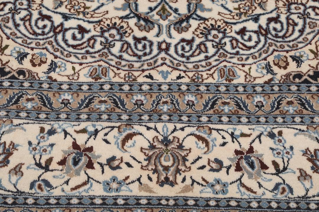 Authentic hand-knotted Nain rug from the Middle East in beige and blue tones