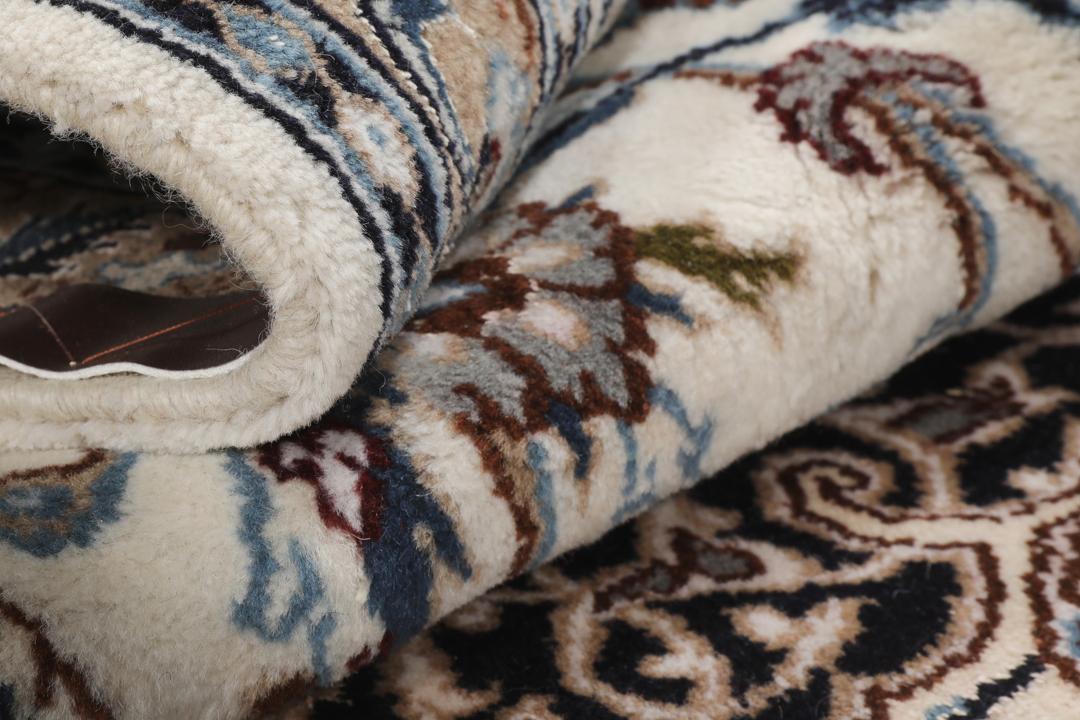 Authentic hand-knotted Nain rug from the Middle East in beige and blue tones