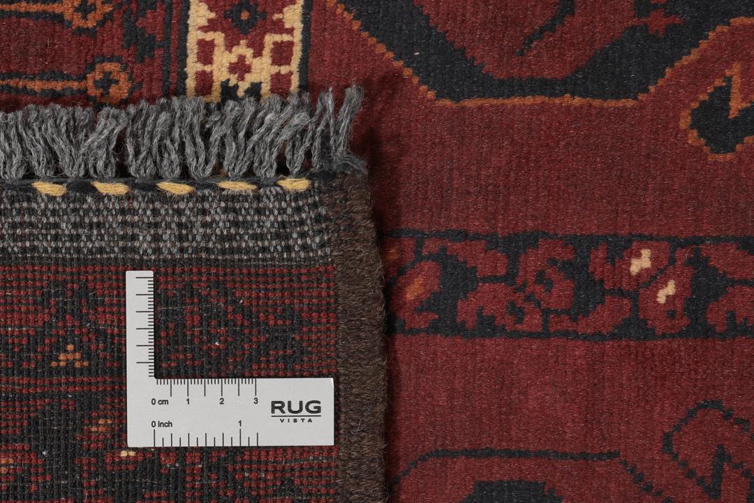 Håndknyttet Kunduz-tæppe fra Afghanistan i dyb rød med geometriske mønstre