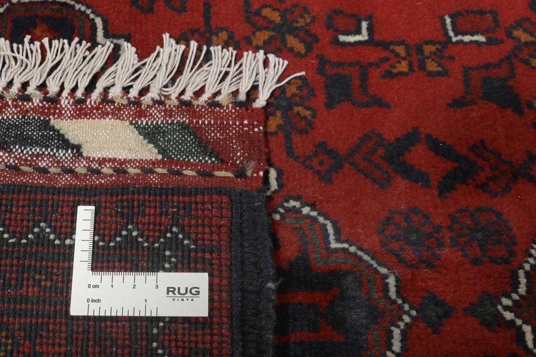 Handgeknoopt Afghaans Kunduz-tapijt in donkerrood met geometrische medaillonpatronen