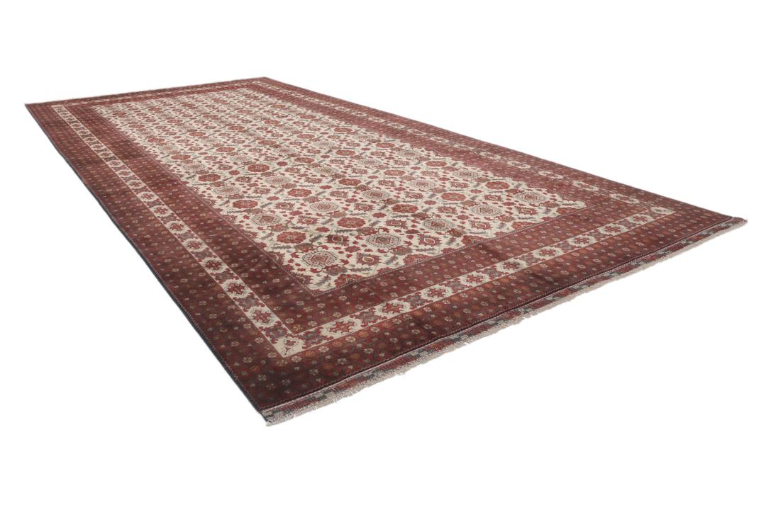 A hand-knotted Kunduz rug from Afghanistan with a red and beige colour palette.