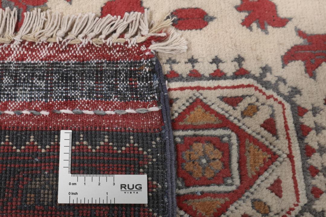 A hand-knotted Kunduz rug from Afghanistan with a red and beige colour palette.