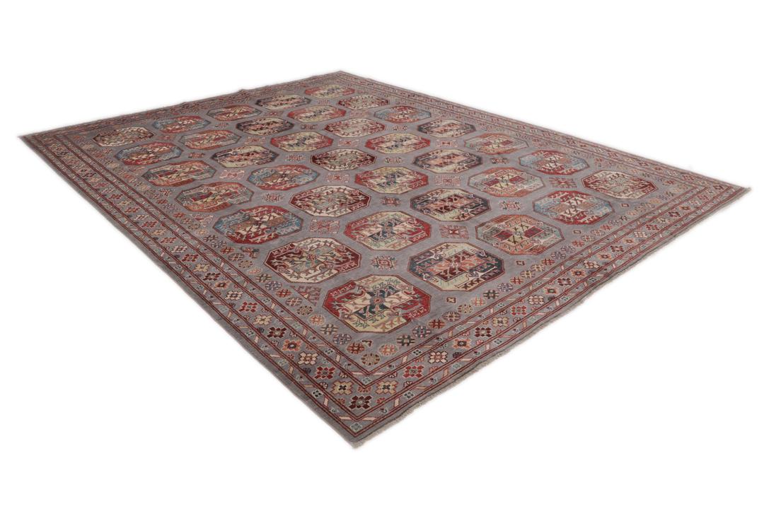 Hand-knotted Afghan Kazak rug with a grey field and geometric medallion motifs.