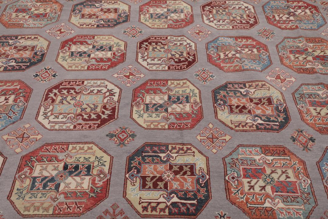 Hand-knotted Afghan Kazak rug with a grey field and geometric medallion motifs.
