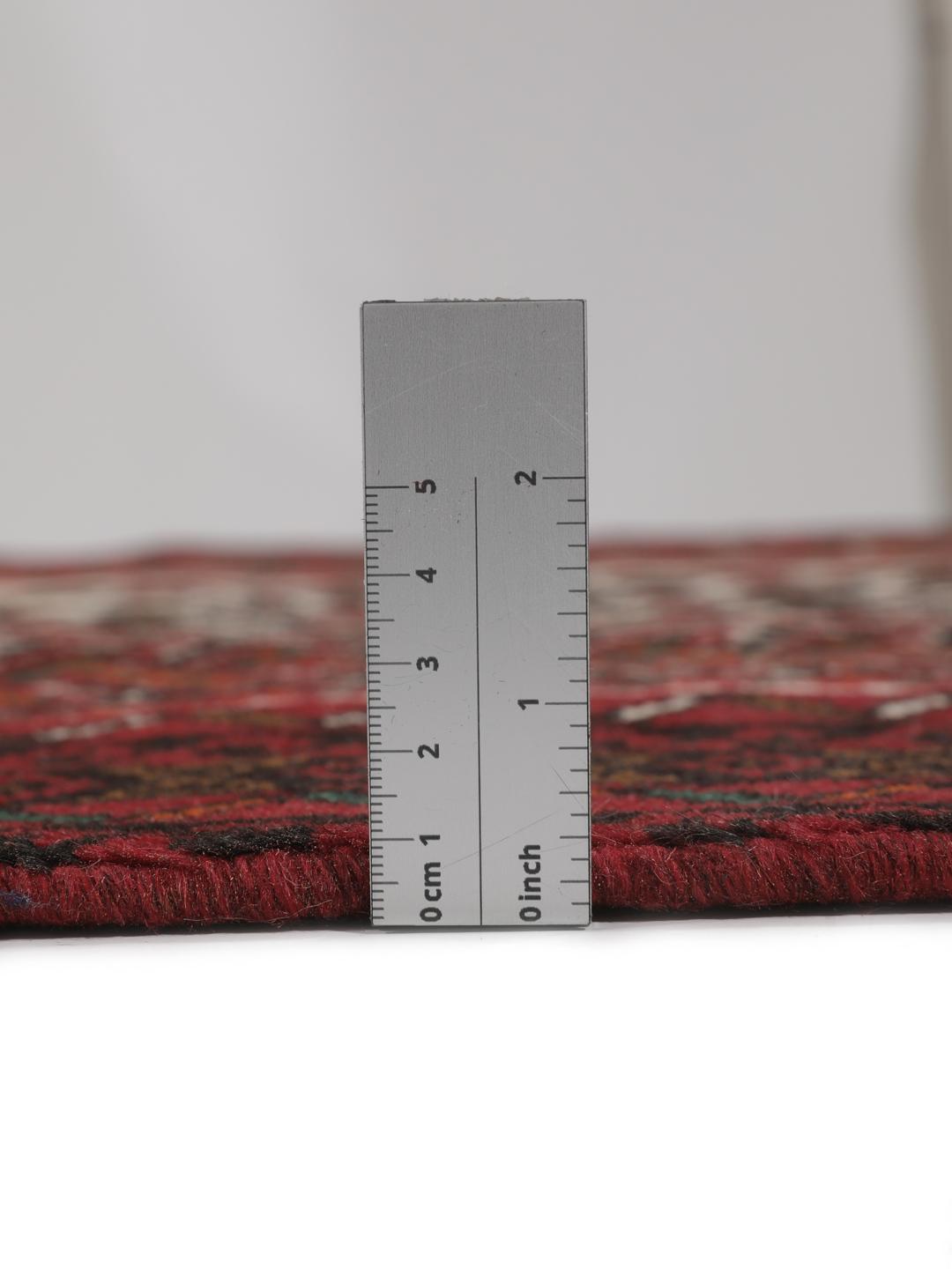 Hand-knotted Middle Eastern rug in red and cream tones