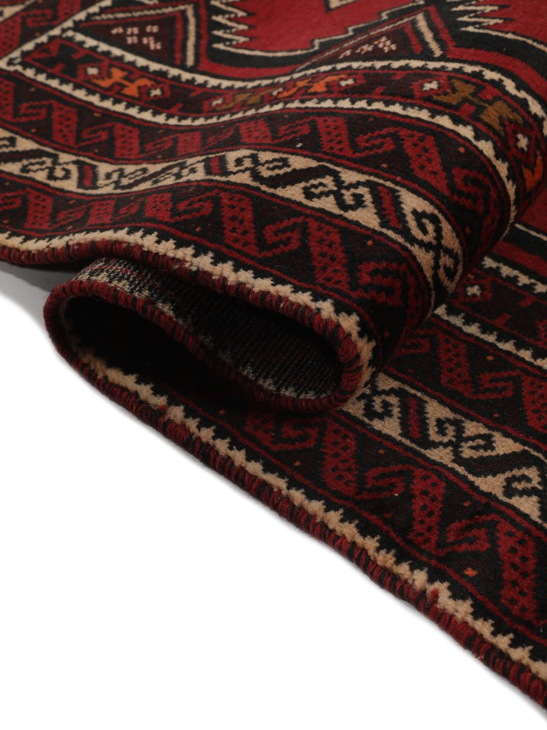 Hand-knotted Middle Eastern Baluch rug in dark red with geometric patterns
