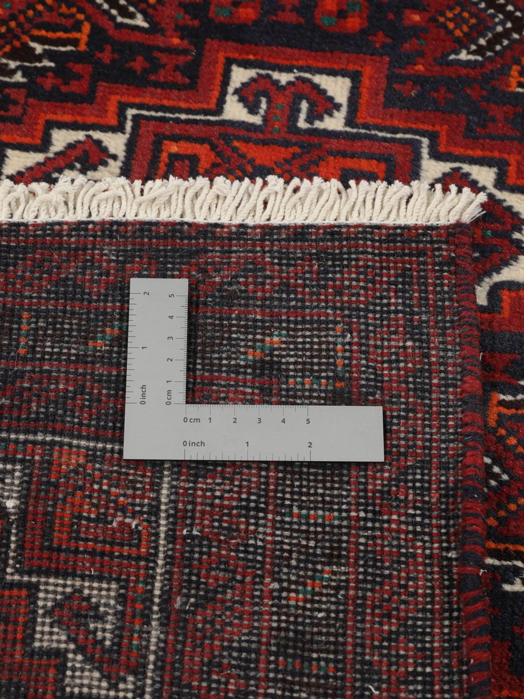 Håndknyttet mørkerødt Baluch-tæppe med komplekse geometriske mønstre