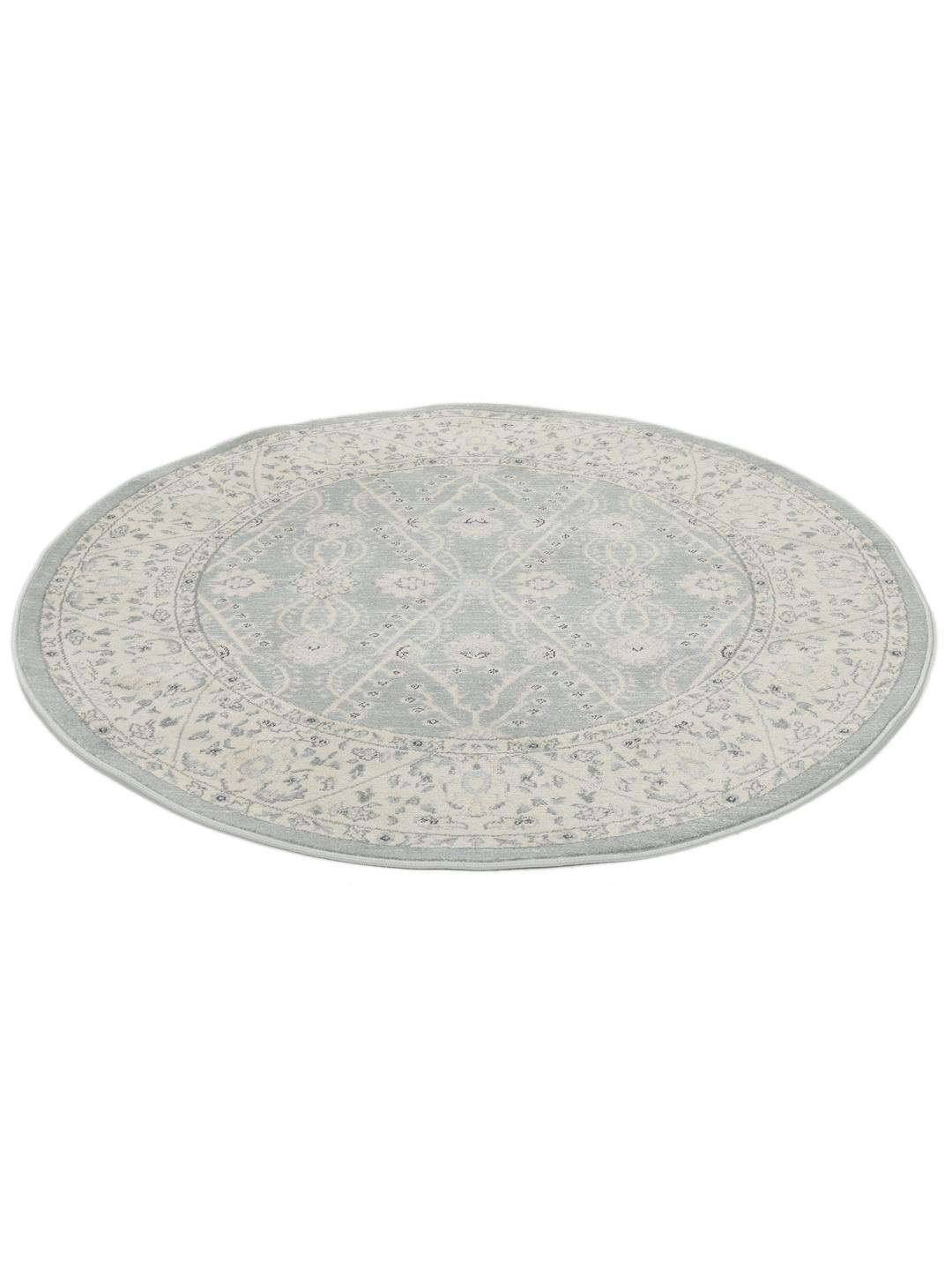 Rond vloerkleed in lichtblauw en crèmekleurig beige met een traditioneel patroon