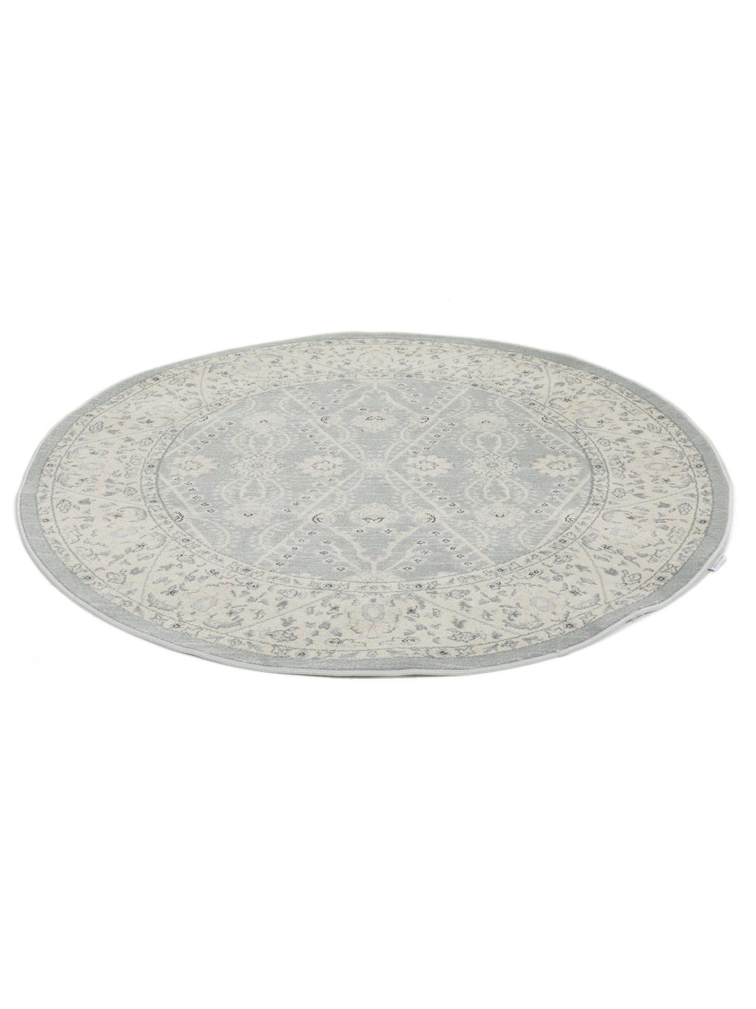 Rond vloerkleed in lichtblauw en crèmekleurig beige met een traditioneel patroon