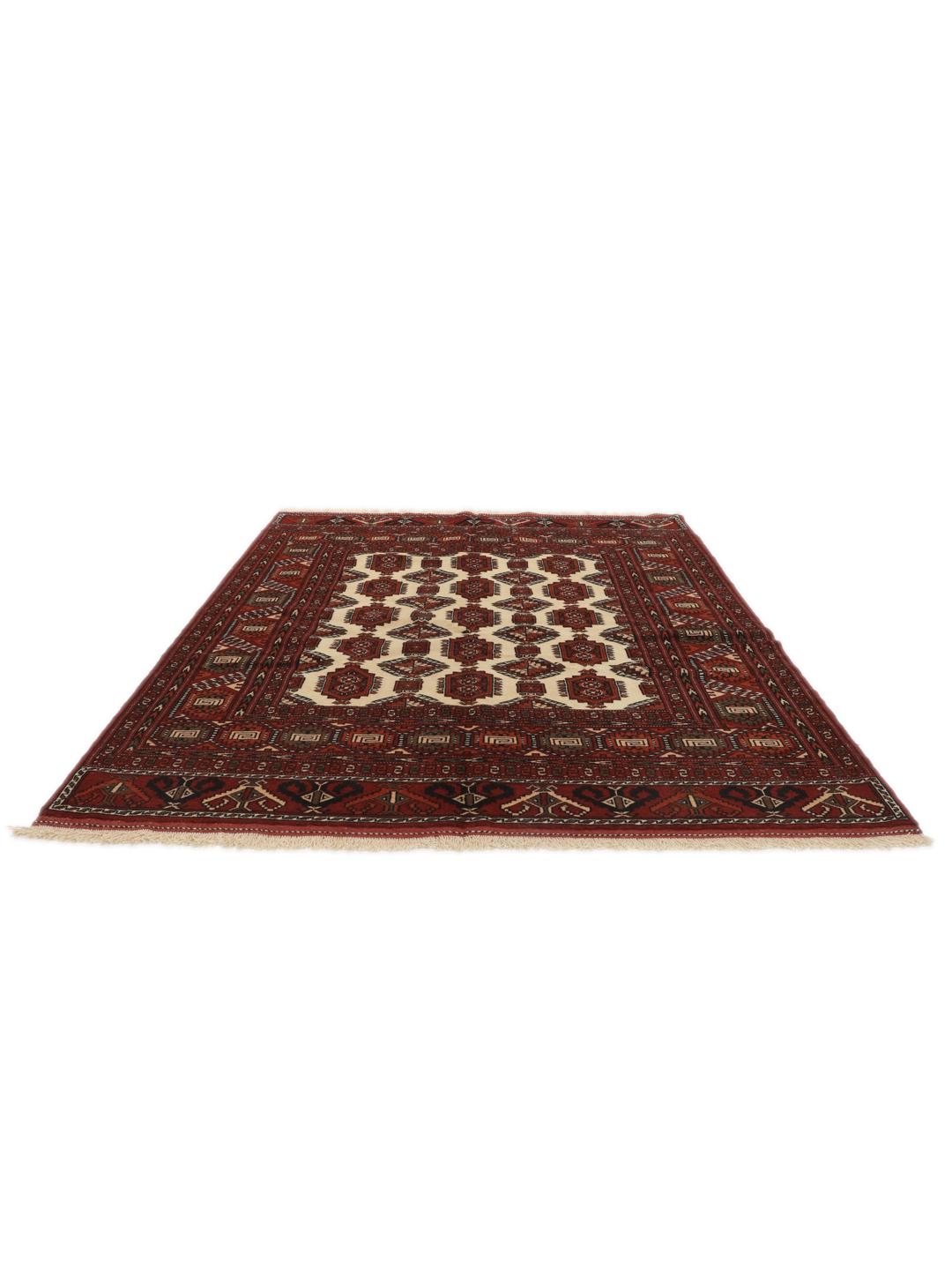 Hand-knotted Turkaman rug from the Middle East featuring a vibrant red and cream colour palette