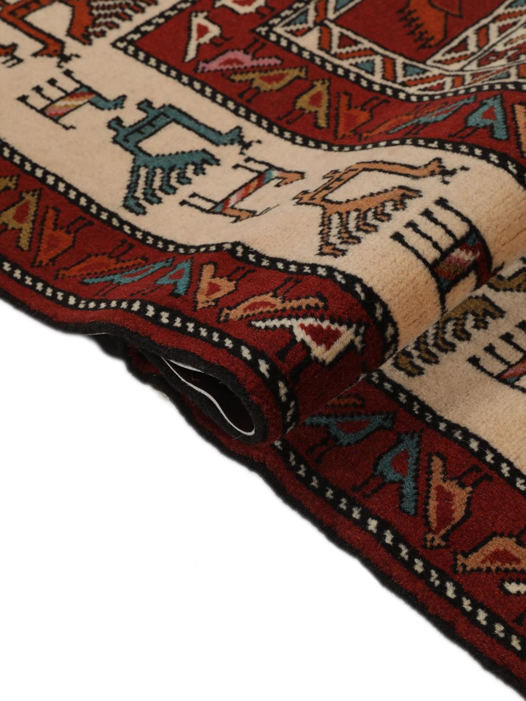 Hand-knotted Middle Eastern rug in red wool with pictorial motifs