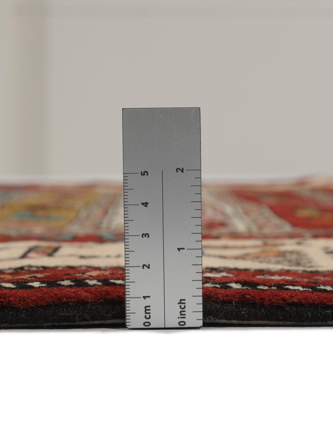Hand-knotted Middle Eastern rug in red wool with pictorial motifs
