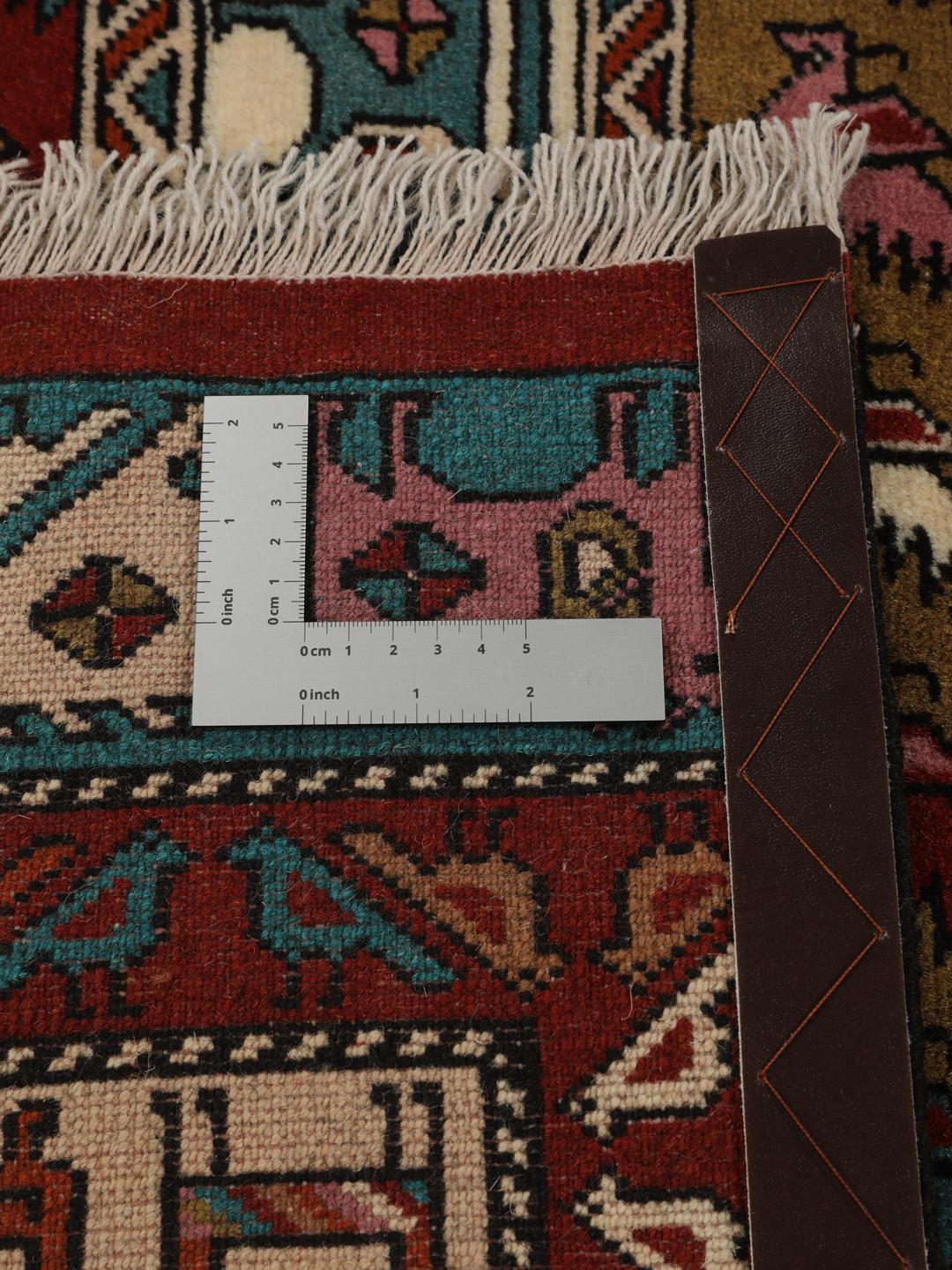 Hand-knotted Middle Eastern rug in red wool with pictorial motifs