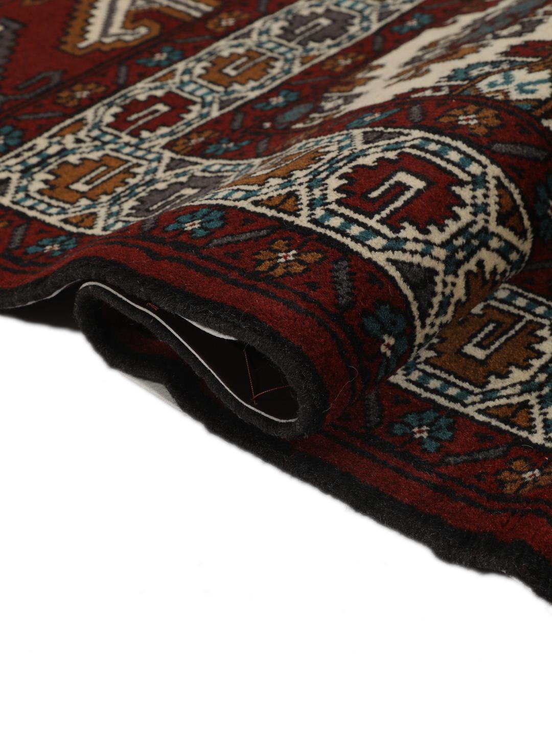 Hand-knotted Middle Eastern Turkaman wool rug in red and beige