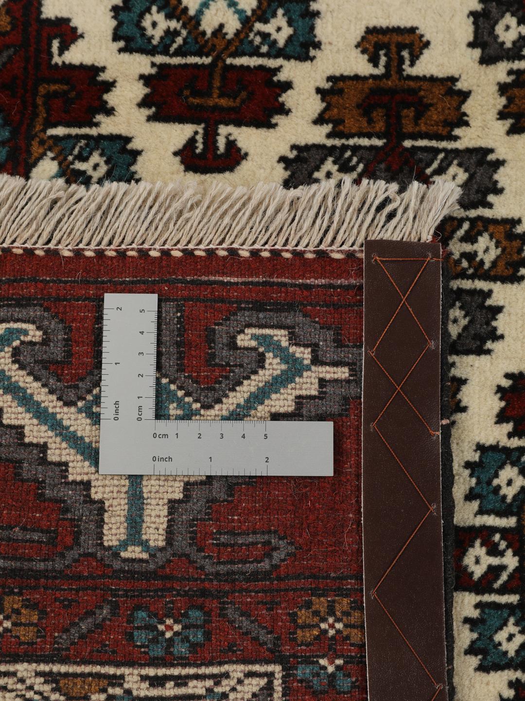 Hand-knotted Middle Eastern Turkaman wool rug in red and beige