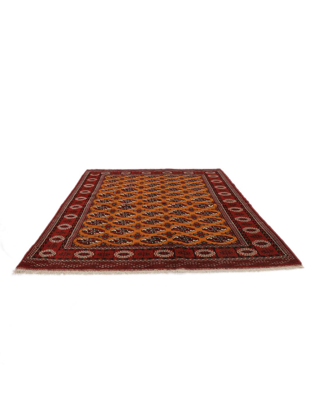 Hand-knotted Turkaman rug from the Middle East featuring an amber field and dark red border.