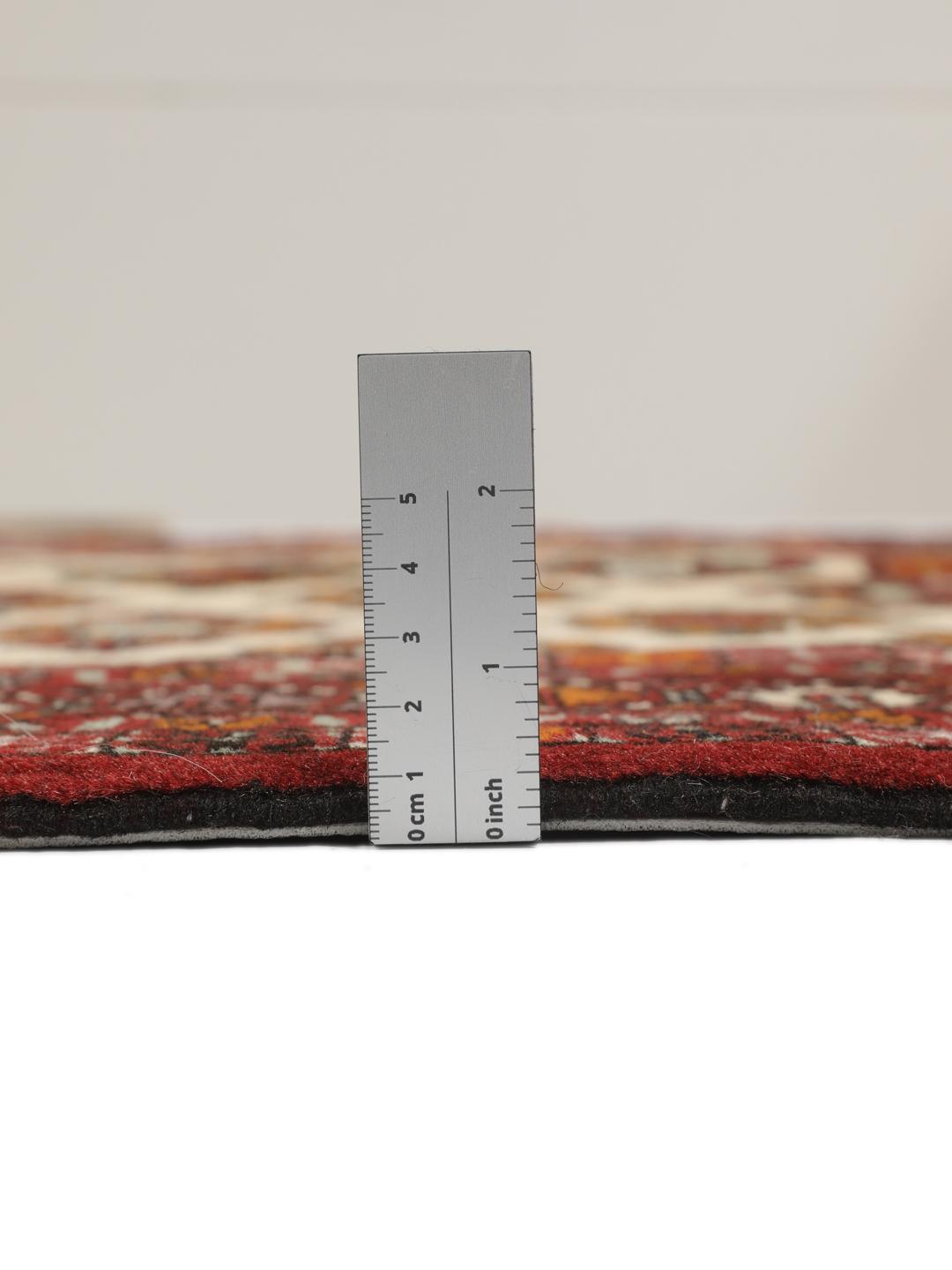 Hand-knotted Turkaman Wool rug from the Middle East in deep red and beige tones