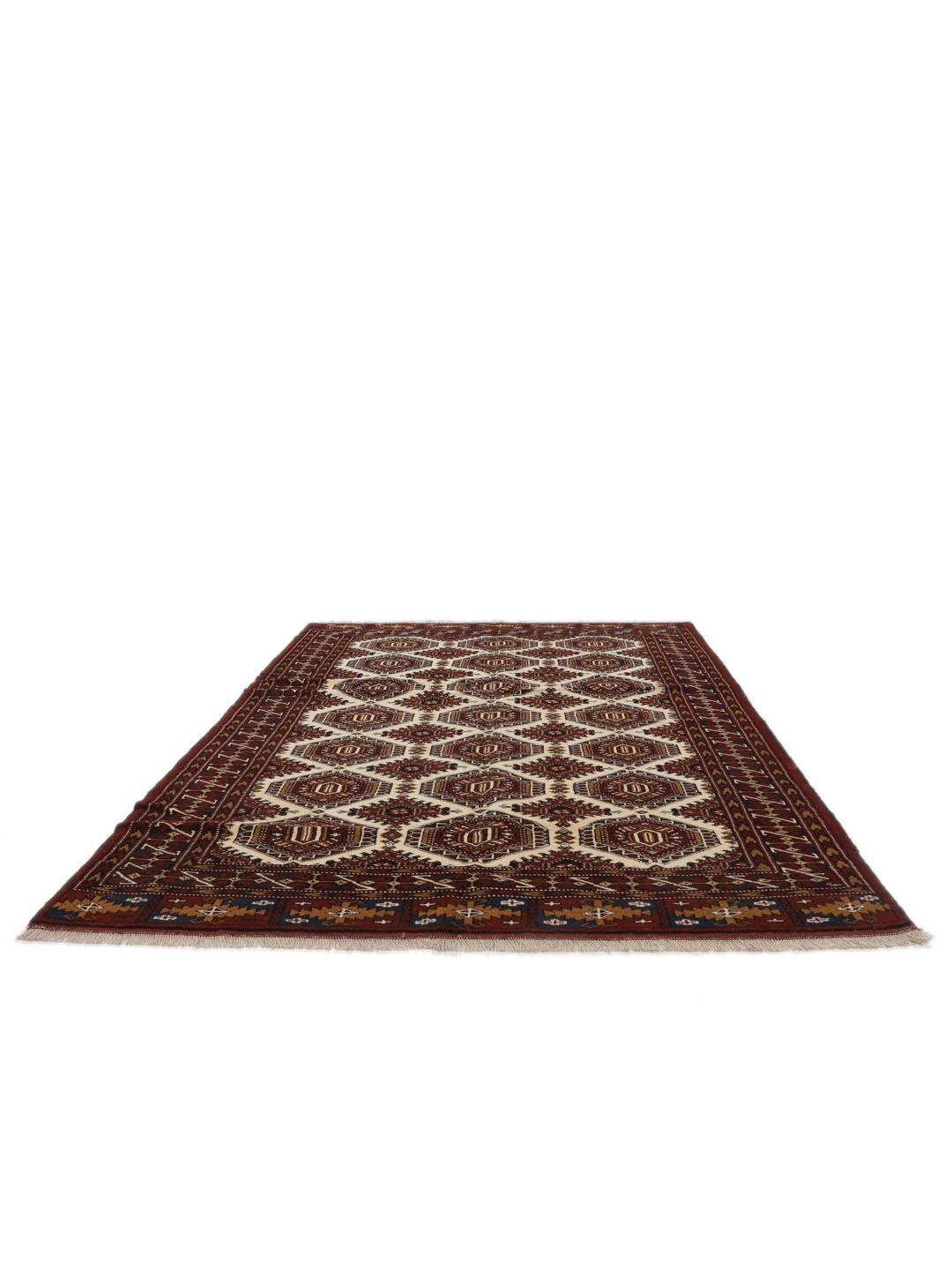 Hand-knotted Turkaman rug from the Middle East in deep red and beige tones