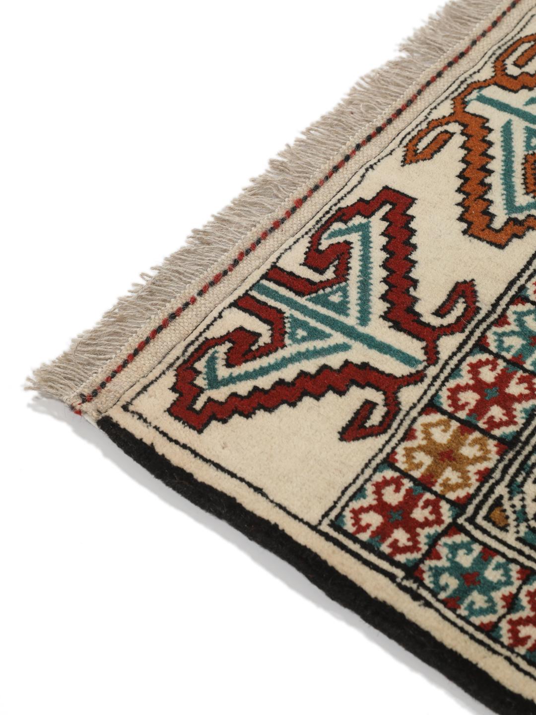 Hand-knotted Turkaman rug from the Middle East in beige with repeating geometric motifs